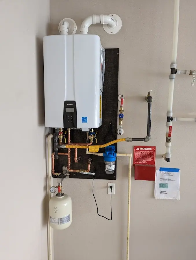 Professional plumber installing copper piping in a Silver Spring home